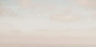 aerial photography of mountain under white sky