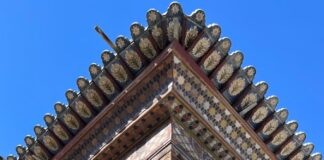 a tall building with columns and a roof
