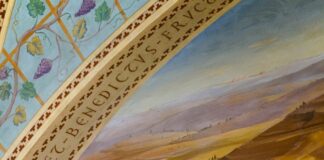 Two women with a baby and flowers