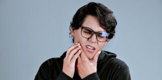 woman in black framed eyeglasses and black long sleeve shirt