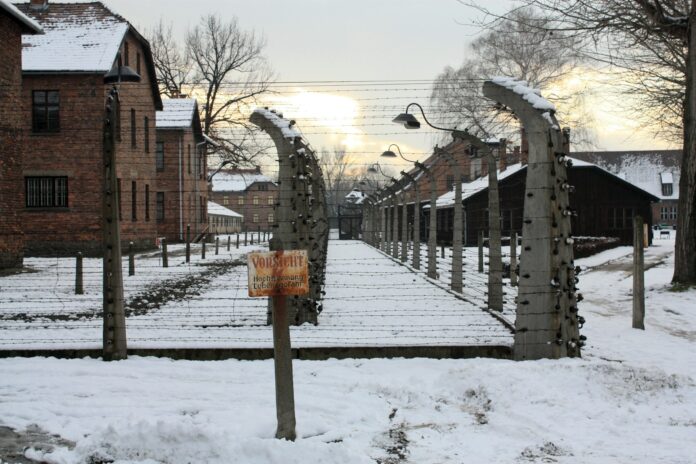 A train track with a bunch of buildings in the background