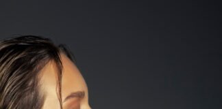 Woman with open mouth reaching for cake