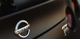 a close up of a nissan emblem on a car