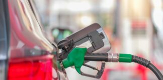 a gas pump is connected to a car at a gas station