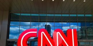 the cnn logo is displayed in front of a building