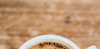 white ceramic mug filled with coffee