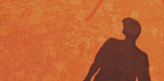 a shadow of a man holding a tennis racket