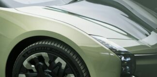 a close up of the front wheels of a sports car