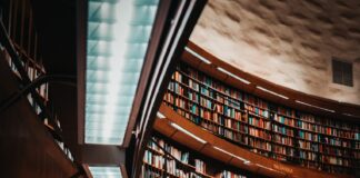 photo of brown wooden bookshelf