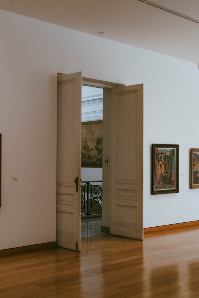 Open doors reveal a glimpse of another room.