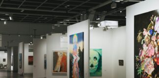 An art gallery showcases various paintings on display.