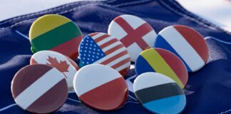 a bunch of buttons with flags on them