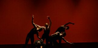 group of people performing on stage