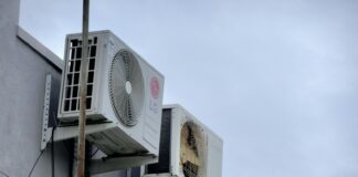 An air conditioner mounted to the side of a building