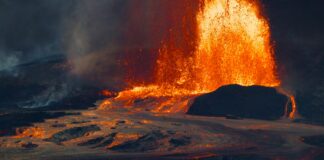 Fiery lava erupts from a volcano during an eruption.