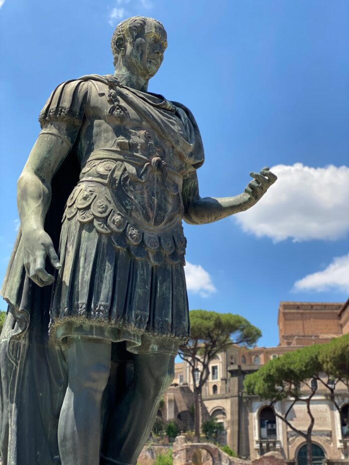 a statue of a person holding a gun
