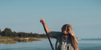 a woman on a paddle board