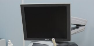 a medical machine with a monitor on top of it