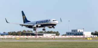 A large jetliner taking off from an airport runway