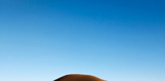 brown sand under blue sky during daytime