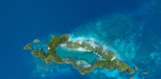 an aerial view of an island in the middle of the ocean